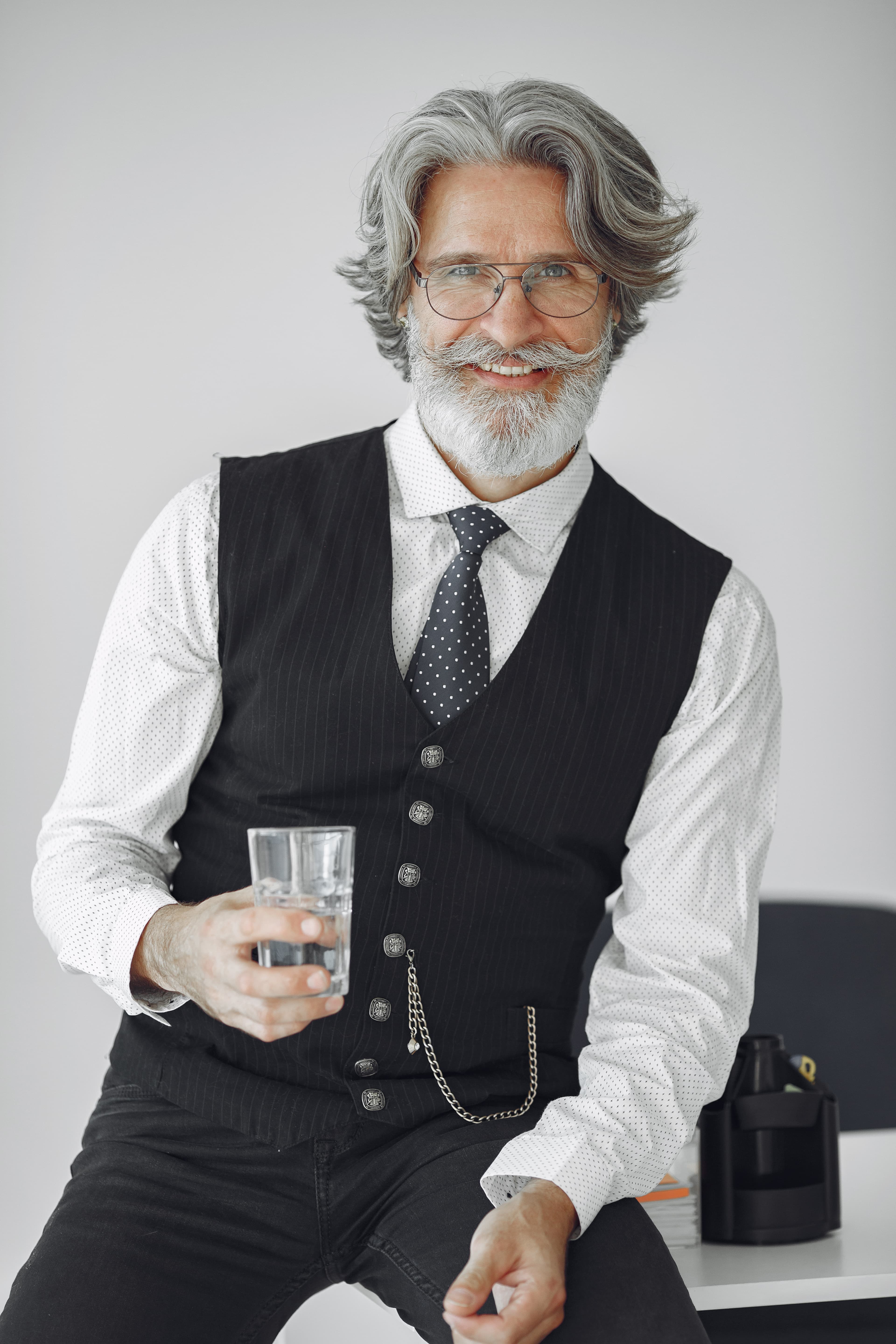 Energetic mature man hydrating after a wellness session