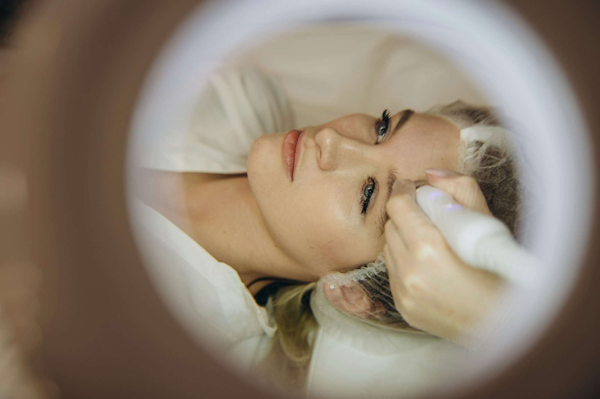 Close-up Of Woman Getting Facial Hydro Microdermabrasion Peeling Treatment At Cosmetic Beauty Spa